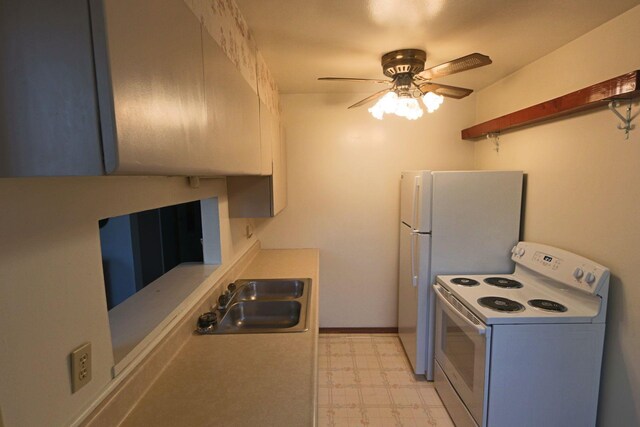 kitchen featuring electric range, ceiling fan, a sink, light countertops, and light floors