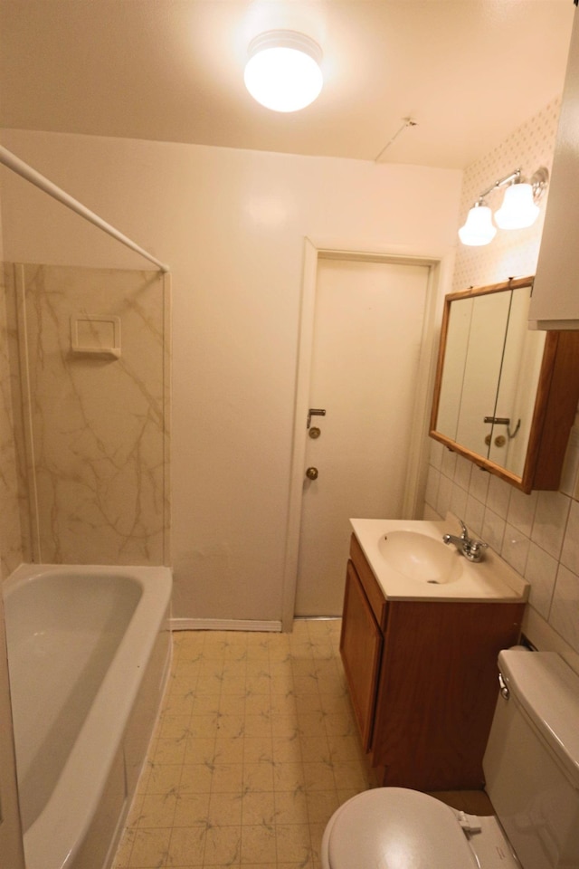 bathroom featuring vanity, tile patterned floors, toilet, and tasteful backsplash
