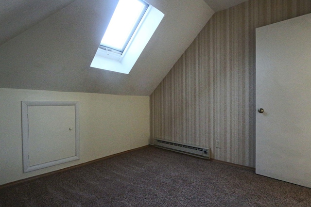 bonus room with baseboard heating, baseboards, lofted ceiling with skylight, carpet flooring, and wallpapered walls