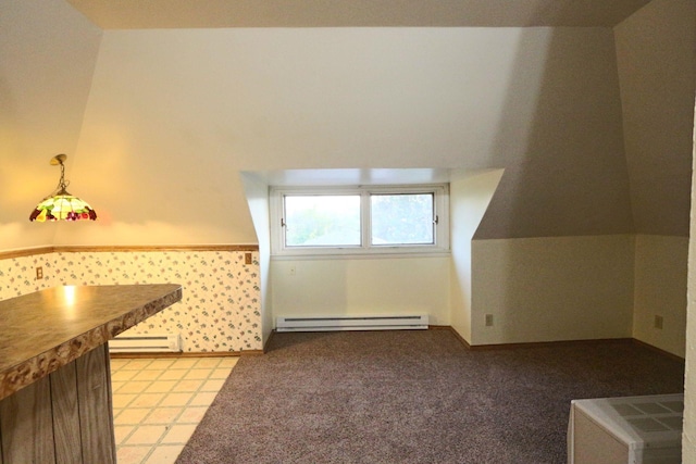 additional living space featuring baseboard heating
