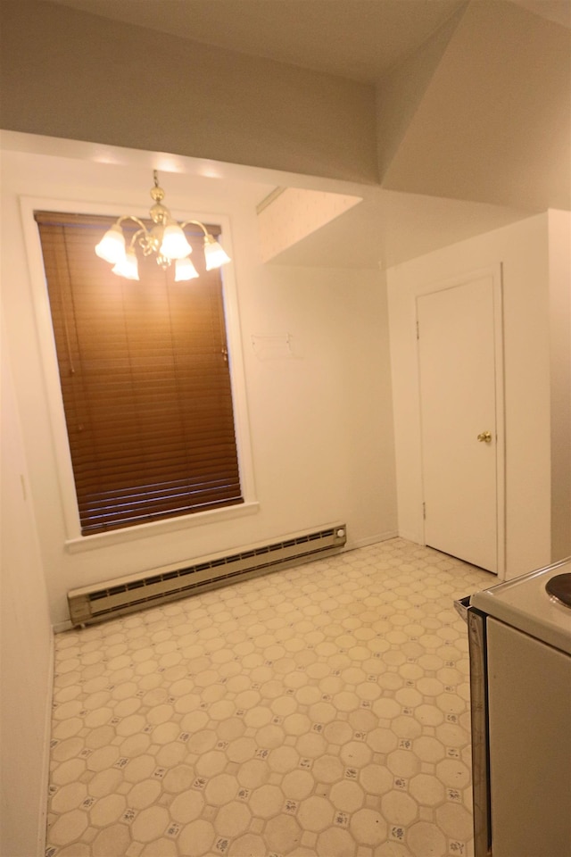 spare room featuring a baseboard radiator, light floors, and a notable chandelier