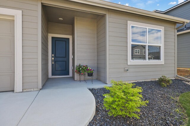property entrance with a garage