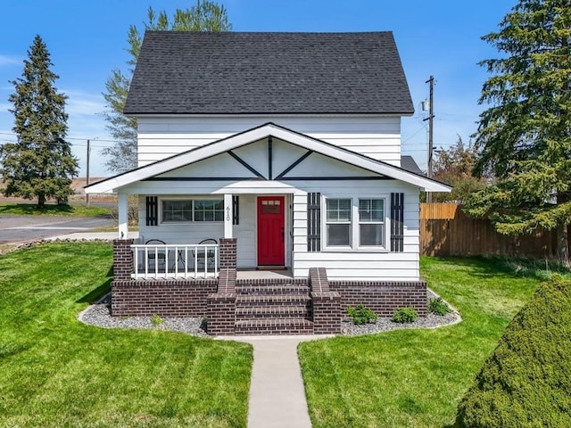 610 Ross St, Davenport, WA 99122 - view of front of house with a shingled roof, a front lawn, fence, and covered porch
