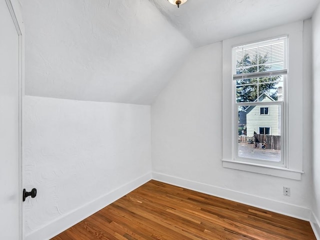 610 Ross St, Davenport, WA 99122 - bonus room with baseboards, wood finished floors, and lofted ceiling