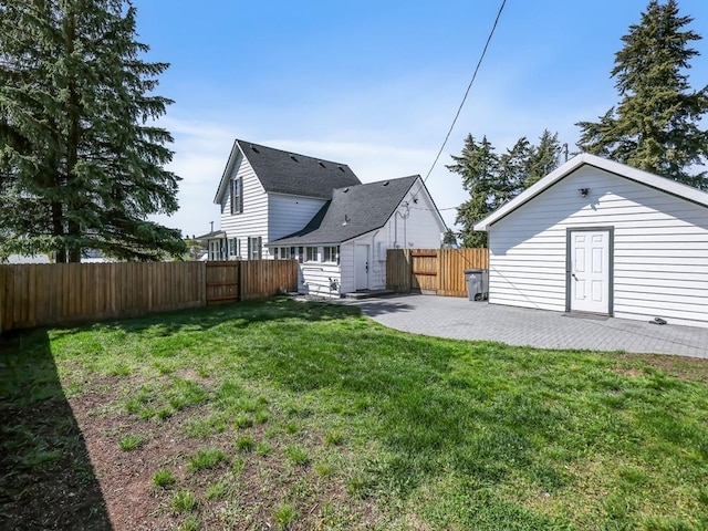 610 Ross St, Davenport, WA 99122 - view of yard with a fenced backyard, a patio area, an outbuilding, and a storage shed