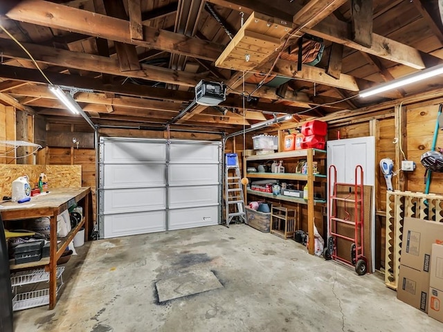 610 Ross St, Davenport, WA 99122 - garage featuring a garage door opener and wood walls
