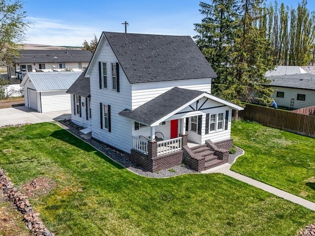 610 Ross St, Davenport, WA 99122 - back of house featuring fence, roof with shingles, an outbuilding, a porch, and a yard