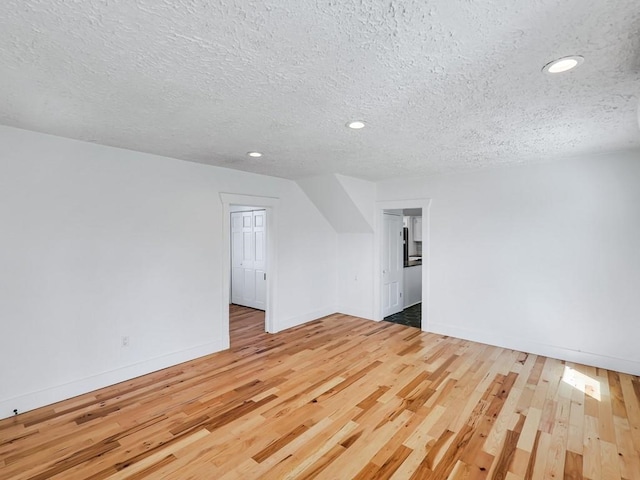 610 Ross St, Davenport, WA 99122 - additional living space featuring recessed lighting, baseboards, a textured ceiling, and wood finished floors
