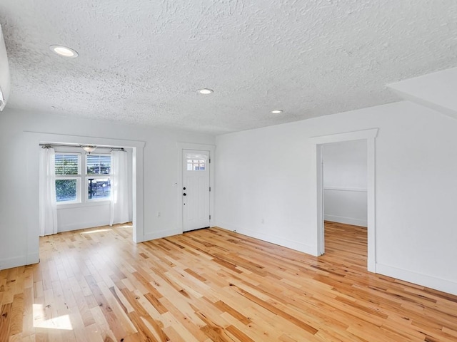 610 Ross St, Davenport, WA 99122 - entrance foyer featuring light wood-style floors, recessed lighting, a textured ceiling, and baseboards