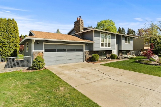 1317 S Woodlawn Rd, Spokane Valley, WA 99216 - view of front of house featuring fence, a chimney, stone siding, and a garage