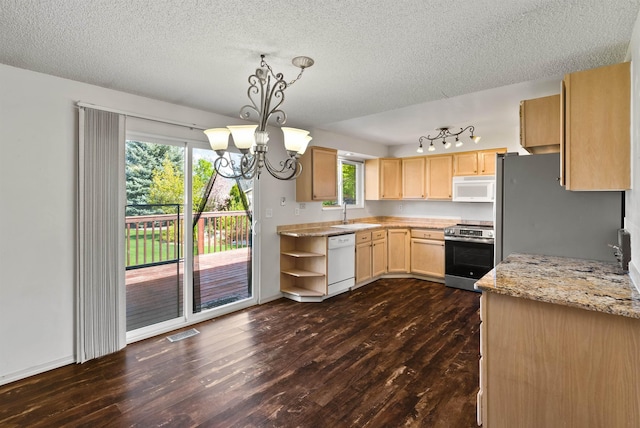 1317 S Woodlawn Rd, Spokane Valley, WA 99216 - kitchen with visible vents, dark wood-style flooring, light brown cabinets, and stainless steel appliances