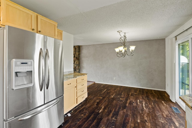 1317 S Woodlawn Rd, Spokane Valley, WA 99216 - kitchen with stainless steel refrigerator with ice dispenser, visible vents, dark wood-style floors, an inviting chandelier, and light brown cabinets
