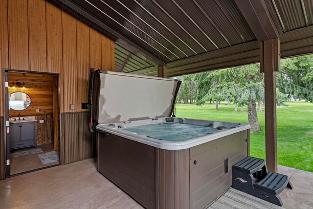 view of patio featuring a sink and a hot tub
