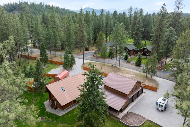 birds eye view of property featuring a mountain view and a forest view