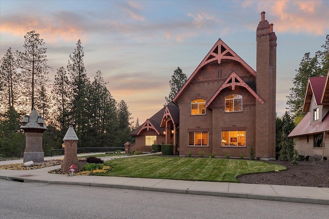 1909 E Pinecrest Rd, Spokane, WA 99203 - view of front of home with a lawn, brick siding, and a chimney