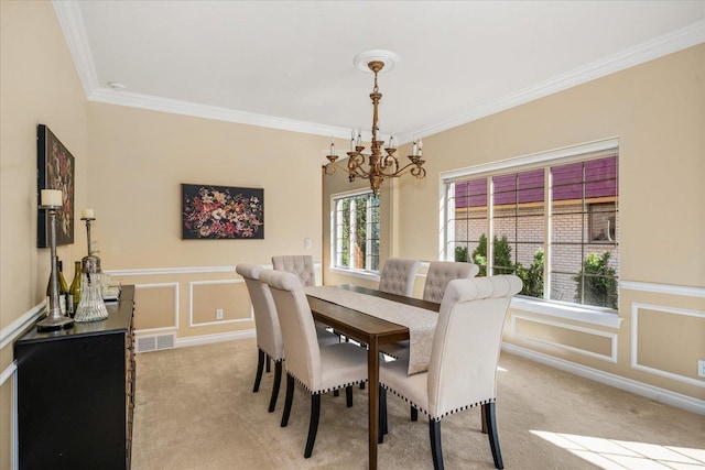 1909 E Pinecrest Rd, Spokane, WA 99203 - dining space featuring a chandelier, light colored carpet, ornamental molding, a decorative wall, and a wainscoted wall