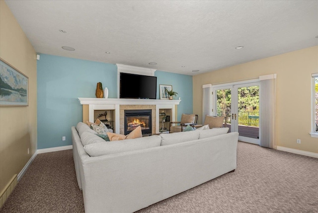 1909 E Pinecrest Rd, Spokane, WA 99203 - carpeted living area featuring baseboards, a tile fireplace, and recessed lighting