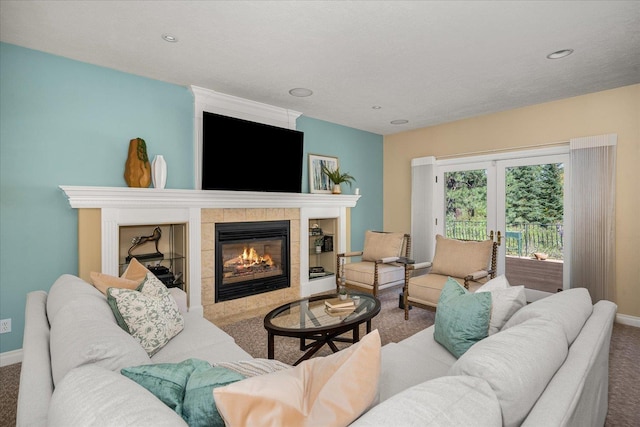 1909 E Pinecrest Rd, Spokane, WA 99203 - carpeted living area featuring baseboards, a tile fireplace, and recessed lighting