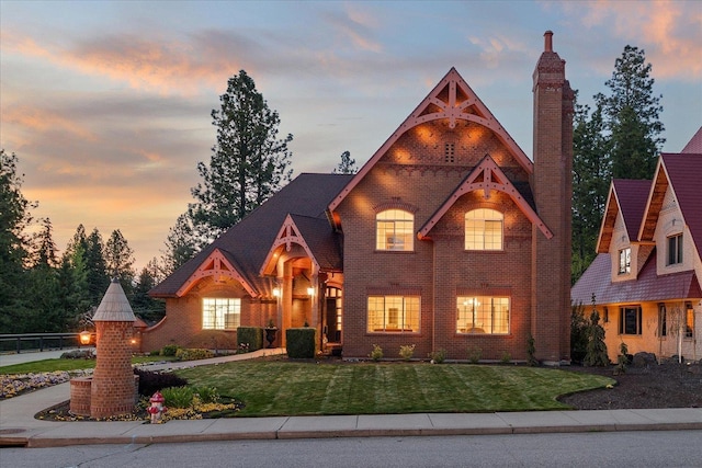 1909 E Pinecrest Rd, Spokane, WA 99203 - view of front of property with a front yard, brick siding, and a chimney