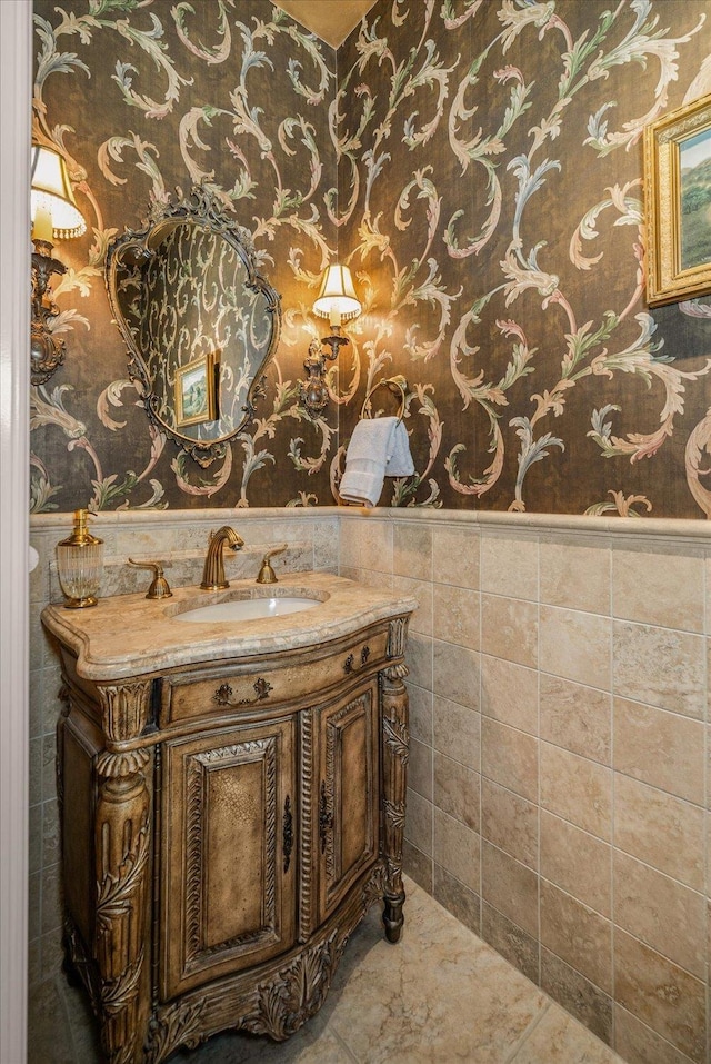 1909 E Pinecrest Rd, Spokane, WA 99203 - bathroom featuring wallpapered walls, a wainscoted wall, and vanity
