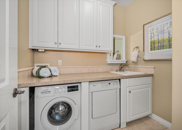1909 E Pinecrest Rd, Spokane, WA 99203 - laundry area featuring separate washer and dryer, cabinet space, and light tile patterned floors