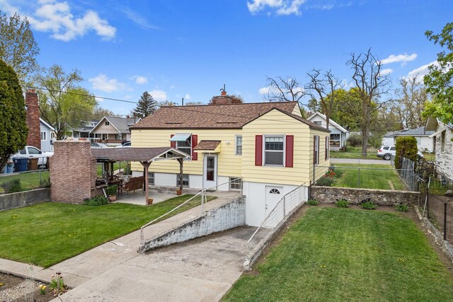 bungalow-style home featuring a patio, a fenced backyard, a front yard, and concrete driveway