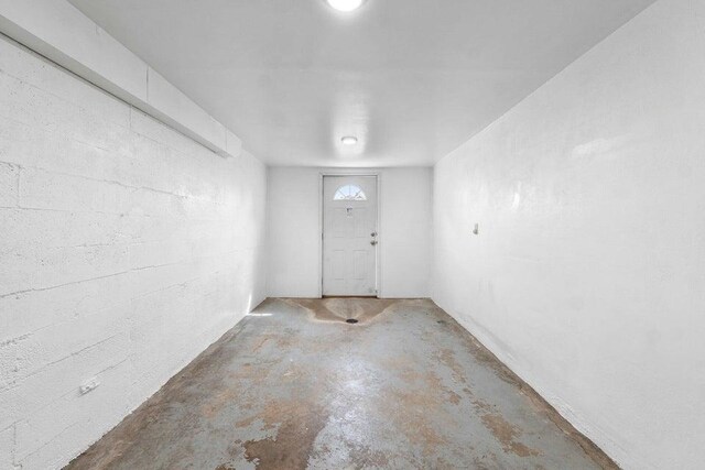 interior space with unfinished concrete flooring
