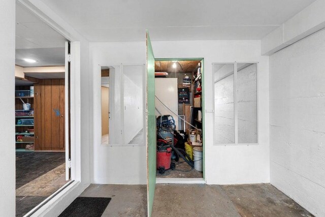 interior space featuring unfinished concrete flooring