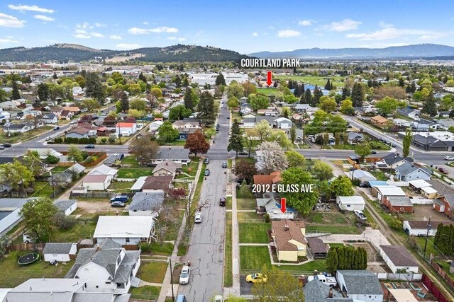 aerial view featuring a residential view and a mountain view