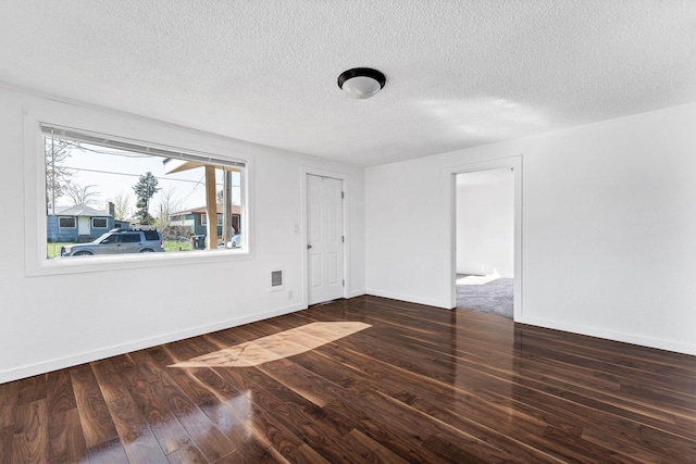 5804 N Regal St, Spokane, WA 99208 - unfurnished room featuring baseboards, a textured ceiling, wood finished floors, and visible vents