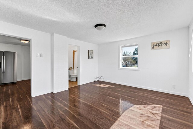 5804 N Regal St, Spokane, WA 99208 - interior space with baseboards, a textured ceiling, and wood finished floors