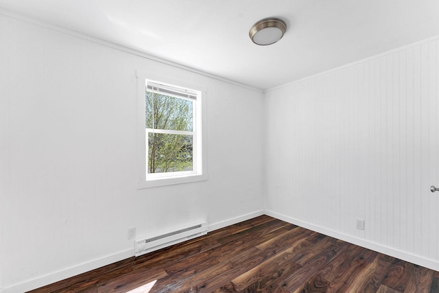 5804 N Regal St, Spokane, WA 99208 - empty room featuring baseboards, ornamental molding, baseboard heating, and dark wood finished floors