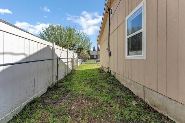 5804 N Regal St, Spokane, WA 99208 - view of home's exterior featuring fence and a yard