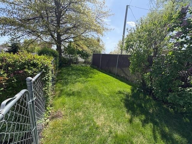 view of yard with fence