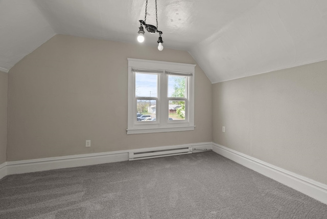 additional living space featuring carpet floors, baseboards, a baseboard heating unit, and lofted ceiling