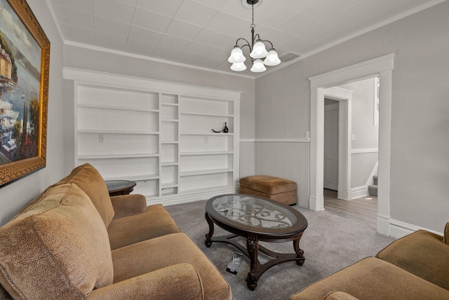 living area featuring carpet floors, crown molding, stairs, visible vents, and a chandelier