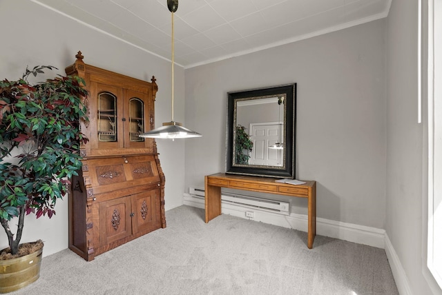 interior space featuring crown molding, a baseboard heating unit, and light carpet