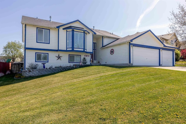 view of front of home with an attached garage, fence, driveway, and a front yard