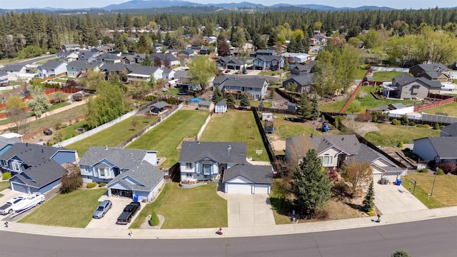 aerial view featuring a residential view and a view of trees
