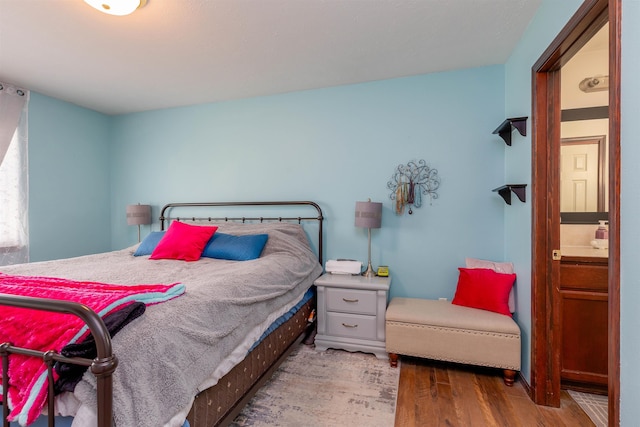 bedroom with wood finished floors