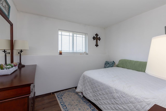 bedroom with dark wood-style floors