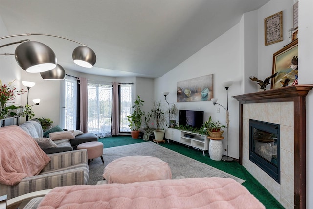 carpeted living room featuring vaulted ceiling and a fireplace