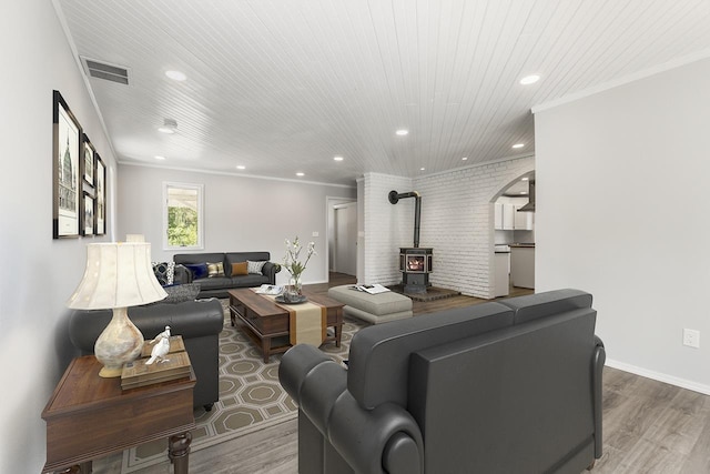 572 Smiley Ln, Newport, WA 99156 - living room with a wood stove, recessed lighting, wood finished floors, and visible vents