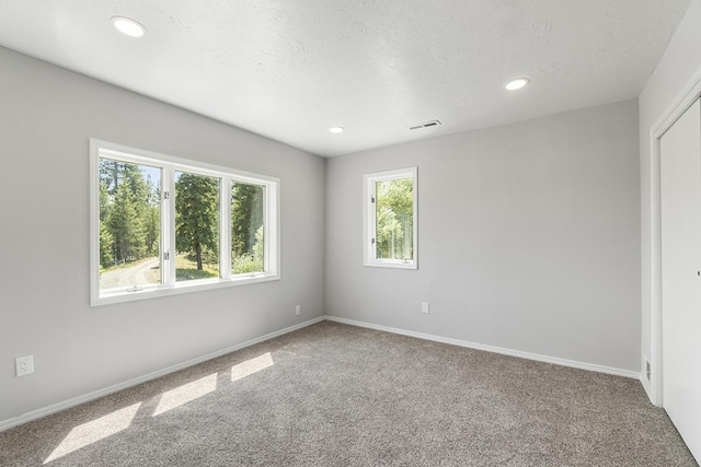 572 Smiley Ln, Newport, WA 99156 - unfurnished room featuring baseboards, carpet flooring, and recessed lighting