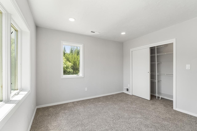 572 Smiley Ln, Newport, WA 99156 - unfurnished bedroom with carpet floors, recessed lighting, baseboards, visible vents, and a closet