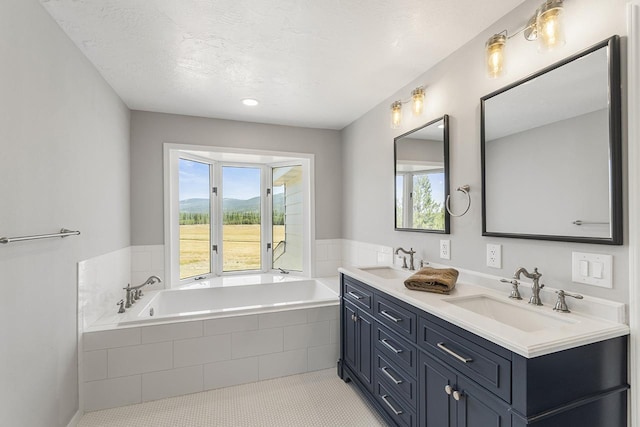 572 Smiley Ln, Newport, WA 99156 - full bathroom with a sink, a garden tub, and double vanity