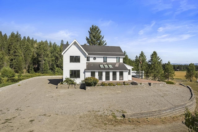 572 Smiley Ln, Newport, WA 99156 - rear view of house with a chimney and metal roof