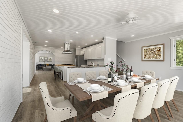 572 Smiley Ln, Newport, WA 99156 - dining room featuring recessed lighting, arched walkways, dark wood-style flooring, and ceiling fan