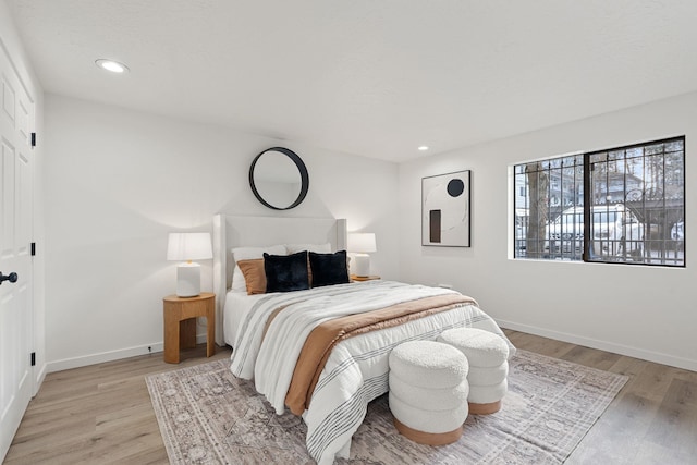 1111 W 6th Ave # 205, Spokane, WA 99204 - bedroom with light wood finished floors, baseboards, and recessed lighting