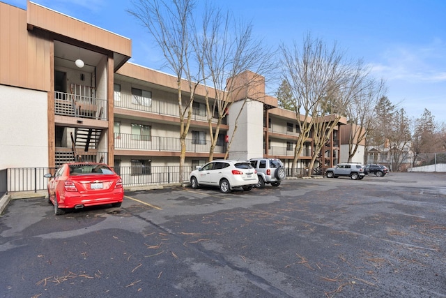 1111 W 6th Ave # 205, Spokane, WA 99204 - view of apartment building / complex featuring uncovered parking
